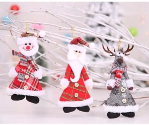 Close-up of Christmas plush ornaments featuring Santa and Snowman with wooden button detail
