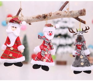 Detail of Christmas plush ornaments featuring Santa, Snowman, and Reindeer with plaid patterns