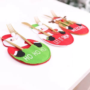 Christmas cutlery holders set featuring Santa, Snowman, and Reindeer holiday designs