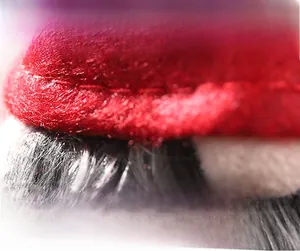Macro detail of high quality red felt fabric and plush fur stitching for wine bottle covers