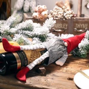 Christmas gnome wine bottle cover decoration with red hat and striped long legs