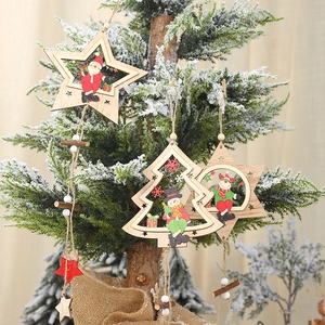 Festive wooden Christmas ornaments featuring hollow star and tree shapes on a tree