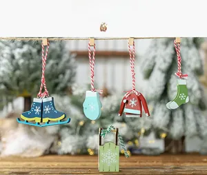 Detailed view of colorful wooden Christmas pendants including skates and sleds with snowflake art