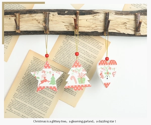 Close-up of wooden Christmas ornaments in heart, star, and tree shapes with hanging beads