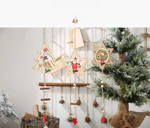 Detail of wooden Christmas star ornaments with painted Santa and snowman figures