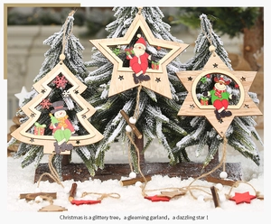 Detailed view of hollow wooden Christmas ornaments with Santa, Snowman and Reindeer motifs