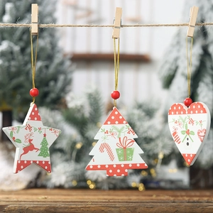 Three-piece set of wooden Christmas ornaments featuring star, tree, and heart shapes with patterns