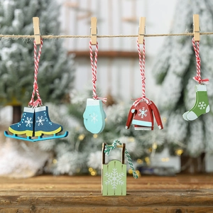 Set of five painted wooden Christmas ornaments with snowflake patterns on red ropes