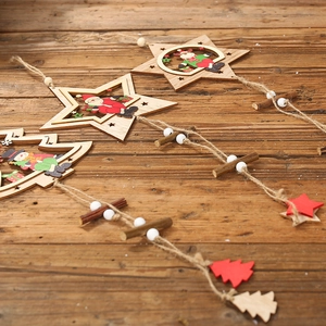 Rustic wooden Christmas pendants with colorful Santa and reindeer on a vintage table