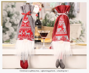 Close-up of Gnome Christmas wine bottle covers with white faux fur beards and knit patterns