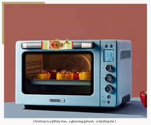 Detail of Christmas gingerbread man embroidery on microwave oven handle cover