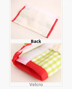 Detail of red plaid microwave handle cover showing adjustable Velcro strap and soft lining