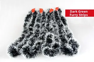 Detail of dark green tinsel garland with white tips for Christmas tree decoration