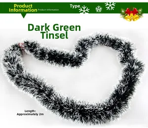 Detailed view of 2m dark green fluffy Christmas tinsel garland with white snowy tips