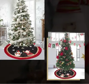 Detailed view of red and black Christmas tree skirt with Santa and snowman motifs