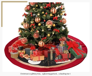 Detail of red and black Christmas tree skirt featuring snowman and plaid patch patterns