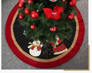 Detail of 120cm Christmas tree skirt featuring Santa, snowman and festive red plaid motifs
