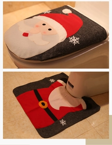 Detail view of Santa Claus themed toilet cover and floor mat set for Christmas decor
