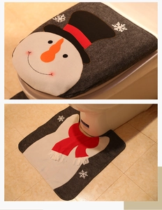 Detail of grey snowman toilet cover and U-shaped rug set with red scarf accent