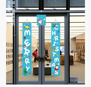 Close-up of blue Merry Christmas banner set with Santa and reindeer on glass door
