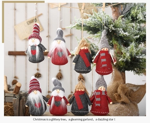 Detail view of 8-piece gnome doll ornaments with red and grey hats for Christmas tree decor
