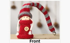 Front view of handmade Christmas doll with red striped hat and silver jingle bell