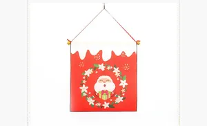 Close-up of Santa Claus banner with festive wreath and golden decorative bells
