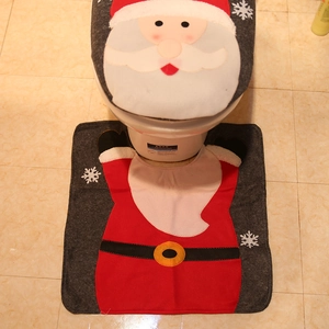 Christmas toilet seat cover set featuring Santa Claus motif with matching U-shaped rug
