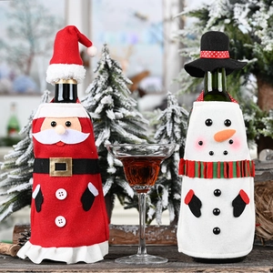Detailed view of Christmas wine bottle covers featuring Santa and Snowman apron sets