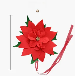 Detail of a 120cm red felt poinsettia flower ornament with golden seeds and long ribbons