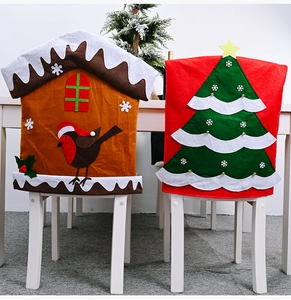 Detail of gingerbread and Christmas tree chair covers showing festive felt appliqué