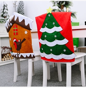 Detail of red Christmas tree and brown gingerbread house non-woven fabric chair covers