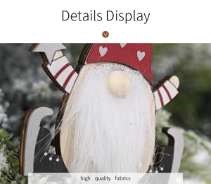 Detail of wooden Christmas gnome ornament with red heart hat and white faux fur beard