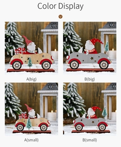 Detail of wooden Santa driving car figurines in natural and grey finishes