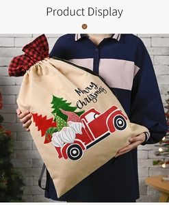 Detail of Christmas gnome drawstring burlap sack with vintage truck and plaid trim
