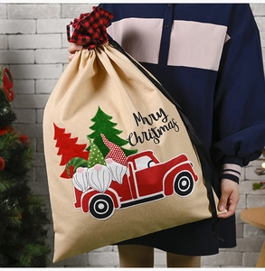 Linen Christmas drawstring bag featuring gnomes in a red truck with Merry Christmas text