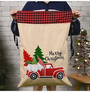 Linen Christmas gift bag featuring red truck, gnome print, and drawstring closure
