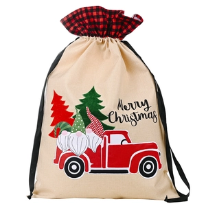 Linen Christmas drawstring gift bag with buffalo plaid, red truck, and gnome print