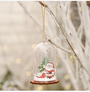 Detail of Christmas hanging ornament with Santa Claus and a sleigh under a clear dome cover