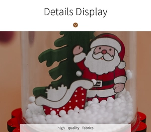 Detail view of transparent Christmas dome with Santa, sled, and white foam snow