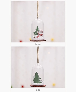 Detail of Christmas bell ornament with transparent dome and wooden base from multiple angles