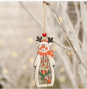 Detailed view of hollow wooden reindeer ornament with star and pine decor on a branch