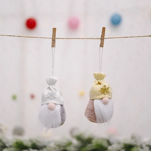 Christmas gnome ornaments with snowflake hats on hemp rope with pine branches and warm lights