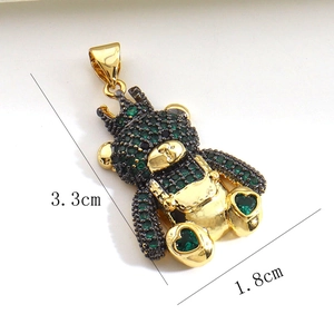 Detailed view of a gold-plated bear pendant with green zircons and size dimensions