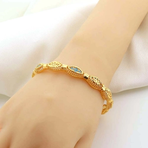Midden-Oosten stijl 18k vergulde armband met filigraan en blauwe turquoise stenen