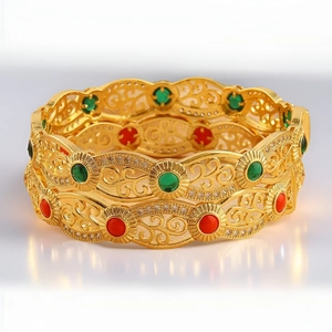 18K gold plated hollow bracelet with red and green stones in a vintage palace style
