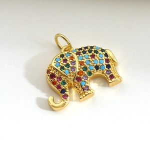 Macro detail of elephant pendant with colorful micro-set zircon in gold finish