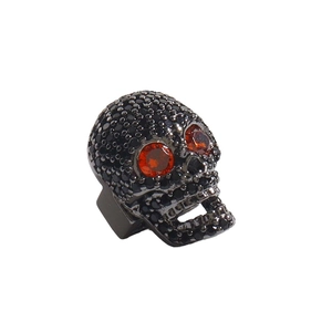 Charm a teschio per bracciali in rame con pietre nere micro-incastonate e occhi arancioni