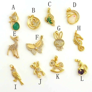 Detailed assortment of gold-plated butterfly and animal pendants with colorful zircon stones