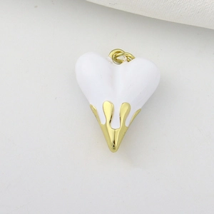 Detail of white enamel and gold liquid heart pendant with a metallic connector ring
